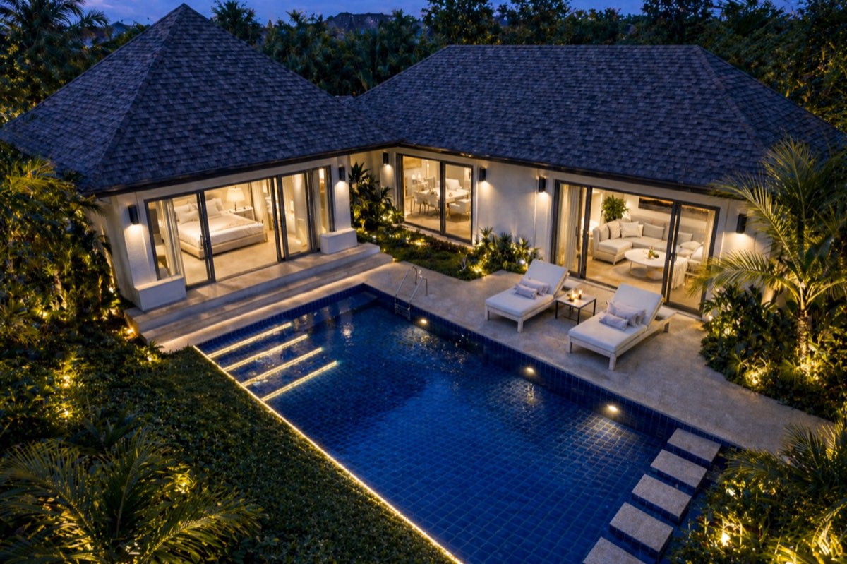 BeachWalk pool villa lit at twilight